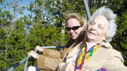 Young Woman and Senior woman smiling outdoors