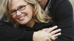 Happy Senior Couple Hugging and Wearing Glasses