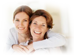 Mom and Daugher Hugging and Smiling